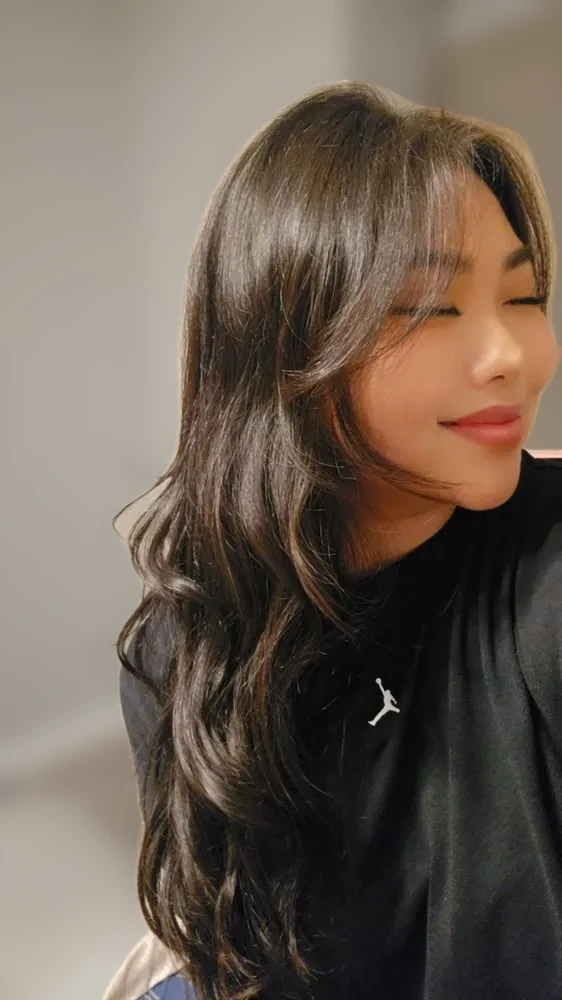 Client selfie with long dark waves