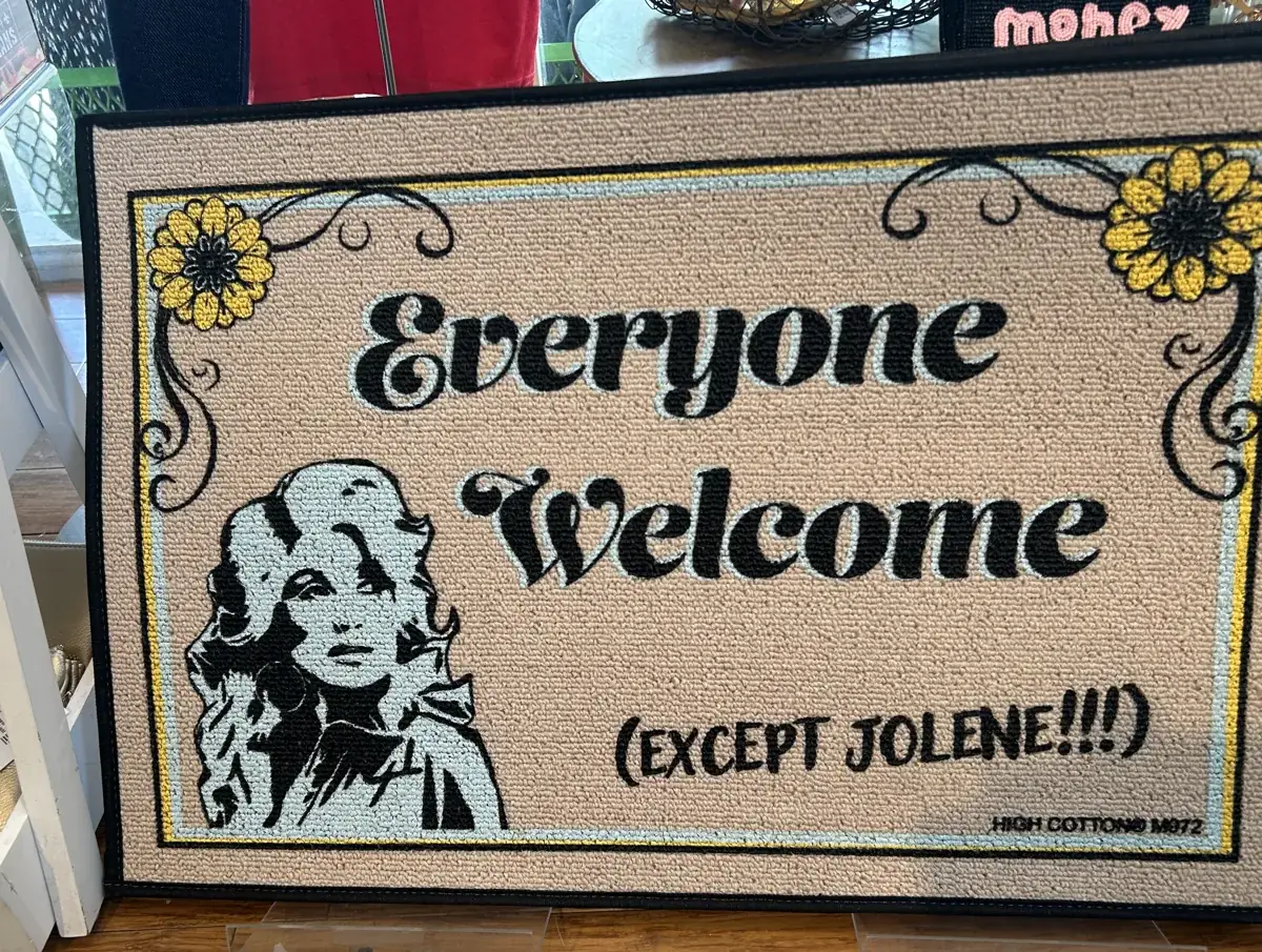 Dolly Parton doormat at the salon reading: Everyone Welcome (Except Jolene!!!)